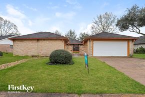 Friendswood house for rent - A house with a sign that says FirstKey Homes.