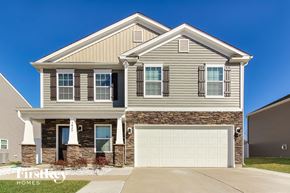 Charlotte house for rent - A two-story house with a garage is for sale.