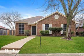 Mesquite house for rent - a small brick house with a yard and a tree
