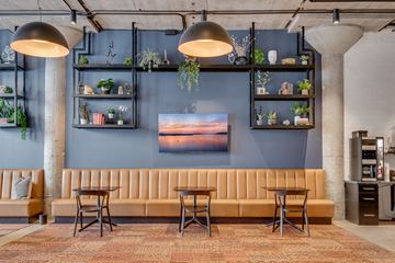 Minneapolis apartment for rent - a living room with blue walls and a couch and tables