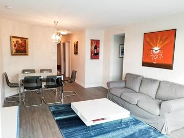 Vancouver apartment for rent - a living room with a couch and a table
