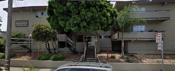 San Rafael apartment for rent - a building with stairs and a tree in front of it