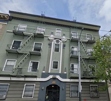 San Francisco apartment for rent - a green building with stairs on the side of it