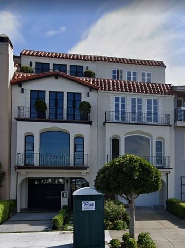 San Francisco house for rent - A two-story house with a balcony and a tree in front.