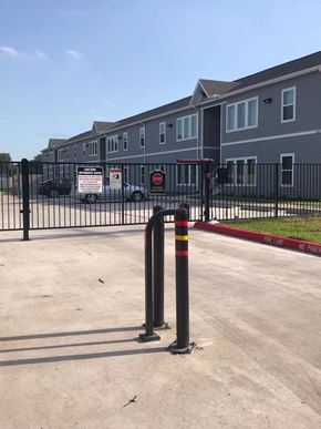 Bay City apartment for rent - a parking lot in front of an apartment building