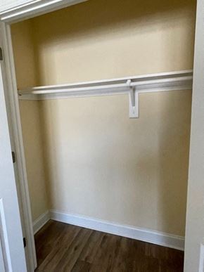 Youngsville apartment for rent - A white closet with a shelf and a white door.