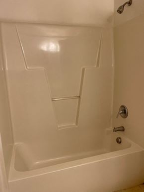 Youngsville apartment for rent - A white bathtub with a silver faucet.