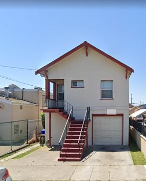 Richmond apartment for rent - a white house with red stairs and a balcony