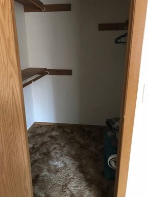 Nikiski apartment for rent - a small room with a closet and a carpeted floor