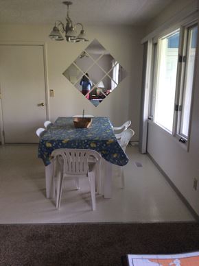Kenai house for rent - A dining room with a table and chairs.