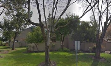 Rohnert Park apartment for rent - a house with a yard and trees in front of it