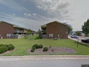 Rocky Mount apartment for rent - a building on the side of a street with a lawn