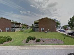 Rocky Mount apartment for rent - a building with a lawn and a parking lot