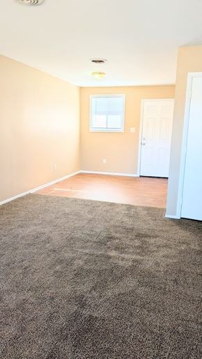 Roxboro apartment for rent - A room with a carpeted floor and a white door.