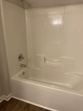Youngsville apartment for rent - A white bathtub with a silver faucet and a silver handle.