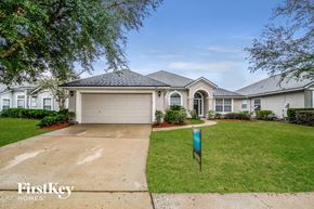 Orange Park house for rent - A house with a sign that says FirstKey Homes.