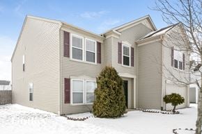 Indianapolis house for rent - the front of a house with snow on the ground