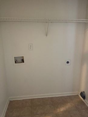 Youngsville apartment for rent - A white wall with a socket and a vent.