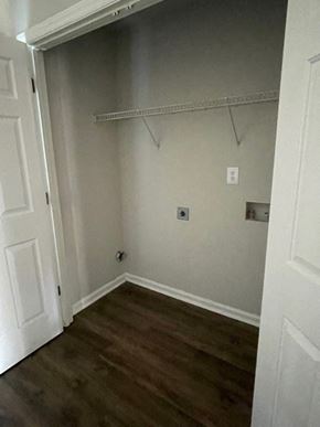 Youngsville apartment for rent - A white door is open to a room with a shelf and a light switch.
