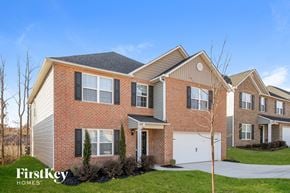 Greensboro house for rent - A large brick house with a garage is for sale.