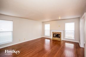 Carmel house for rent - the living room with wood floors and a fireplace