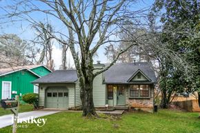Lithonia house for rent - a green and white house with a tree in the front