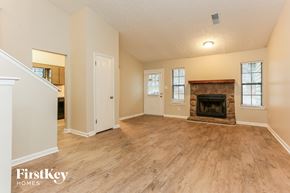 Lithonia house for rent - the living room has a fireplace and hardwood floors