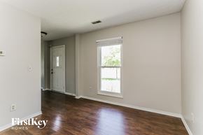 Hilliard house for rent - a living room with wood floors and white walls and a window