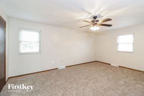 West Chester house for rent - a bedroom with white walls and a ceiling fan