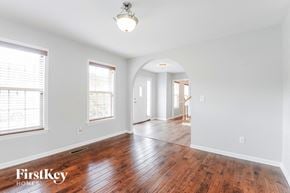 Clemmons house for rent - an empty living room and dining room with wood floors