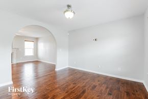 Clemmons house for rent - an empty living room with white walls and wood floors