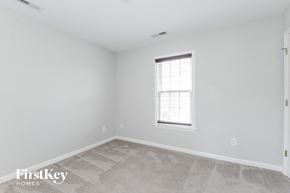 Clemmons house for rent - the living room of a home with white walls and a window