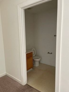 Youngsville apartment for rent - A white toilet is in a small bathroom.