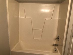 Youngsville apartment for rent - A white bathroom with a door and a handle.