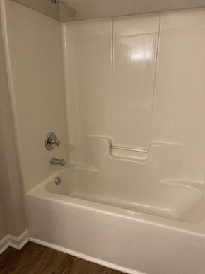 Youngsville apartment for rent - A white bathtub with a silver faucet and a silver handle.