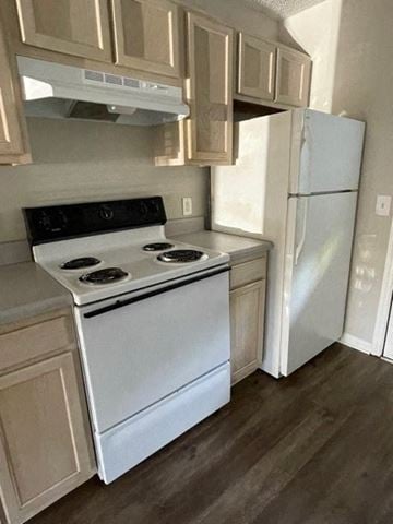 Youngsville apartment for rent - A white stove and refrigerator in a kitchen.