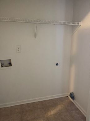Youngsville apartment for rent - A white wall with a white shelf and a small hole in the wall.