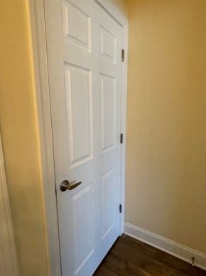 Youngsville apartment for rent - A white door with a silver handle is closed.