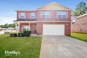 Locust Grove house for rent - A brick house with a garage door is for sale.