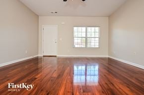 Locust Grove house for rent - A room with wooden floors and a window letting in light.