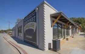 Chamblee apartment for rent - A building with a sign that says "Bust Stop Cafe".