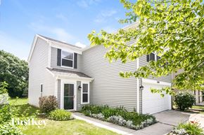 Noblesville house for rent - a white house with a sidewalk in front of it