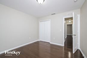Saint Cloud house for rent - the living room of an apartment with wood floors and white walls