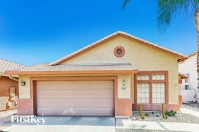 San Tan Valley house for rent - A house with a garage door and a brown roof.