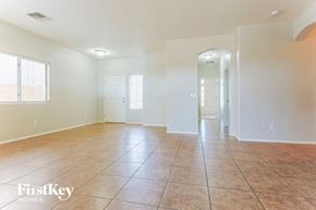 San Tan Valley house for rent - A spacious room with tile flooring and white walls.