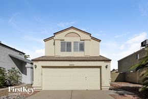 Glendale house for rent - A two-car garage is attached to a house with a beige facade.