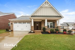 Mint Hill house for rent - A house with a white garage door and a brick wall.