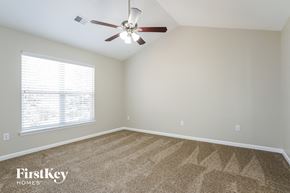 Jamestown house for rent - the master bedroom has a carpeted floor and a ceiling fan