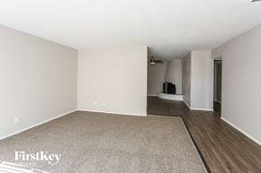 Glendale house for rent - an empty living room with white walls and wood flooring