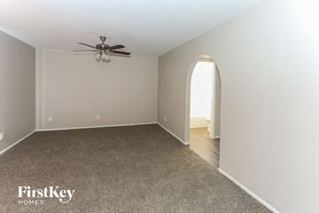 Glendale house for rent - a living room with a carpet and a ceiling fan